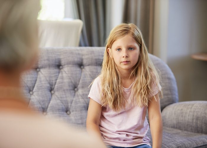 Young girl having therapy with a child psychologist